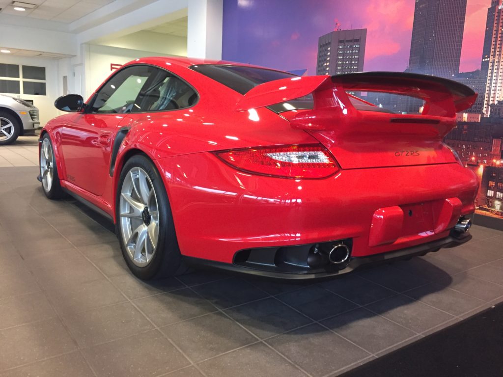 2011 Porsche 911 GT2 RS | Guards Red over Black/Red. 1,750 miles from new.