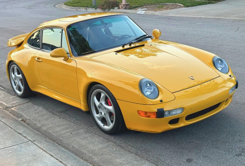 1996 Porsche 911 Turbo | Speed Yellow, all original, factory sport seats, 9,500 miles from new.