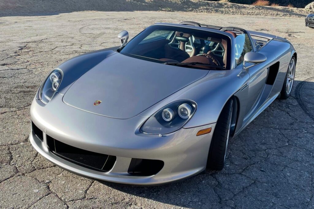 2005 Porsche Carrera GT | GT Silver / Ascot Brown. 3,950 miles.