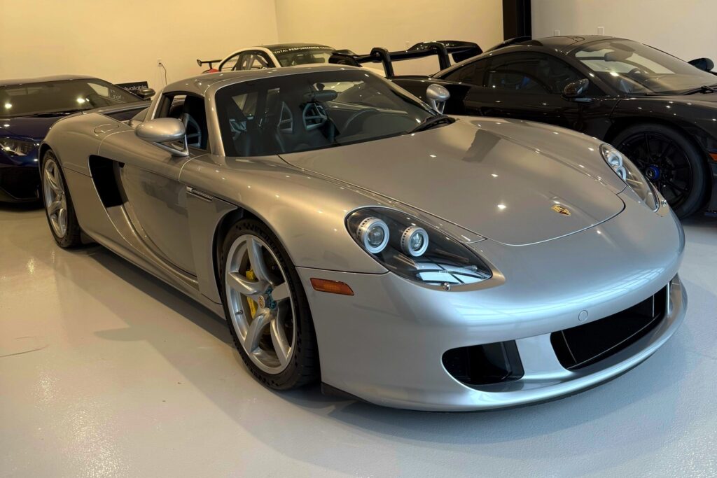 2005 Porsche Carrera GT | GT Silver / Dark Grey. 4,600 miles. Special factory Wheels Painted in Exterior Color. 